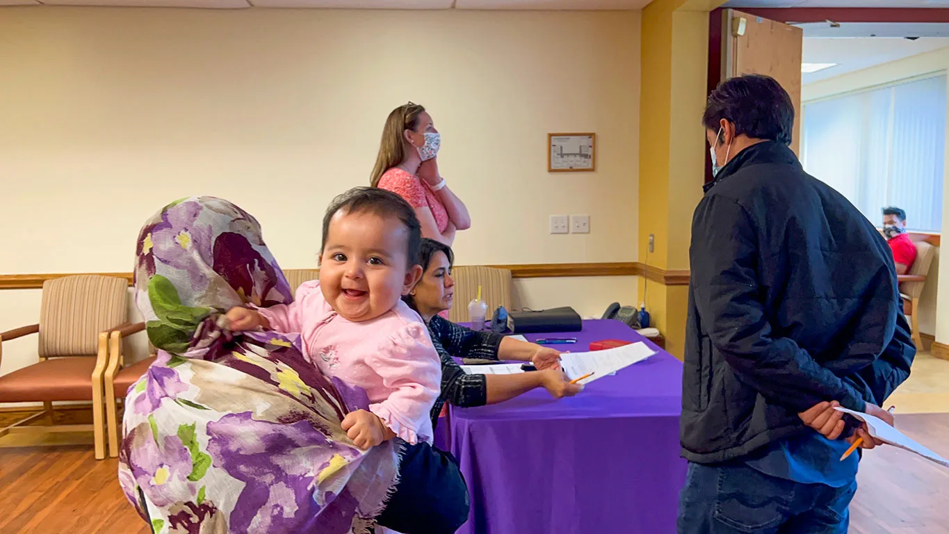 Refugees registering for English classes