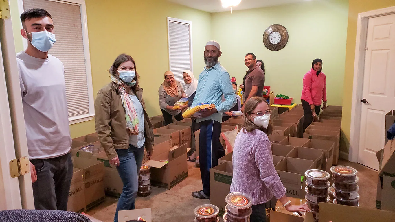 Volunteers organizing Ramadan food boxes