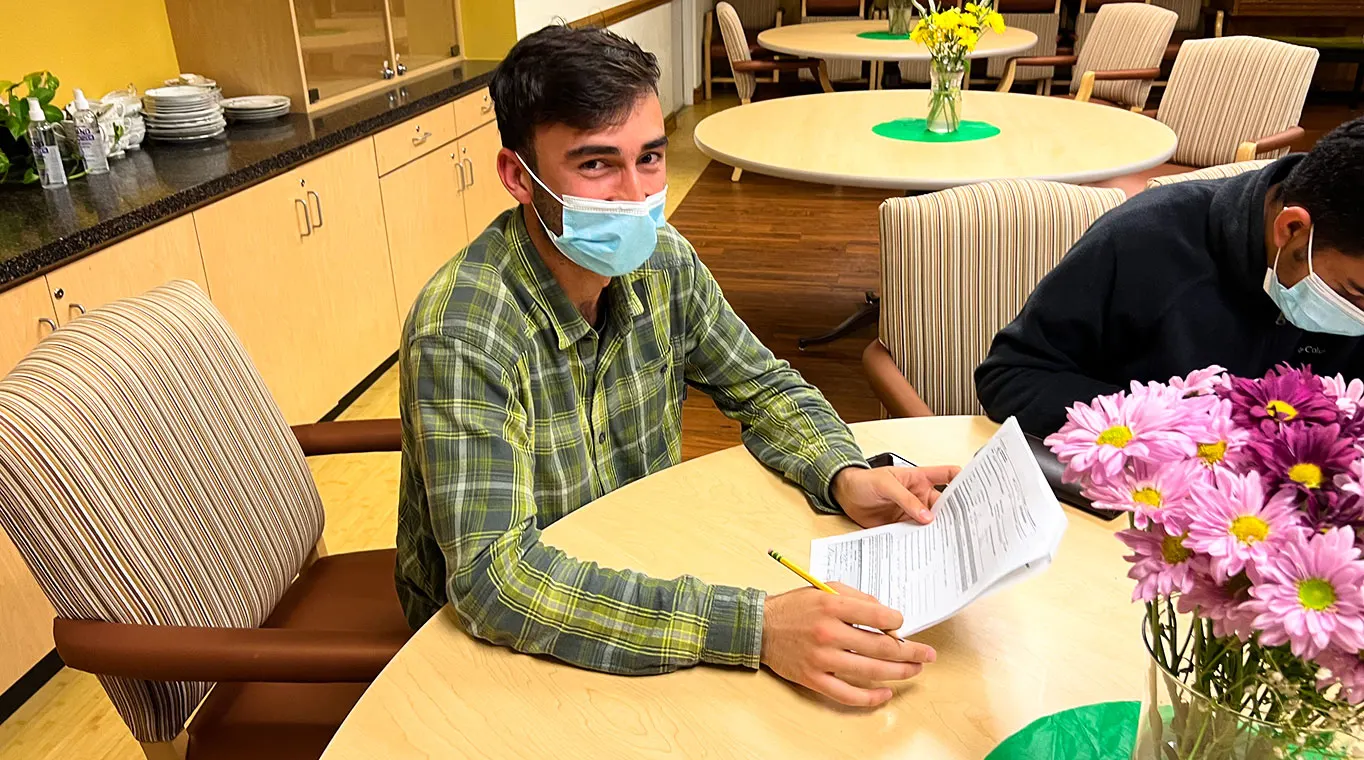 English class enrollment forms filling by refugee