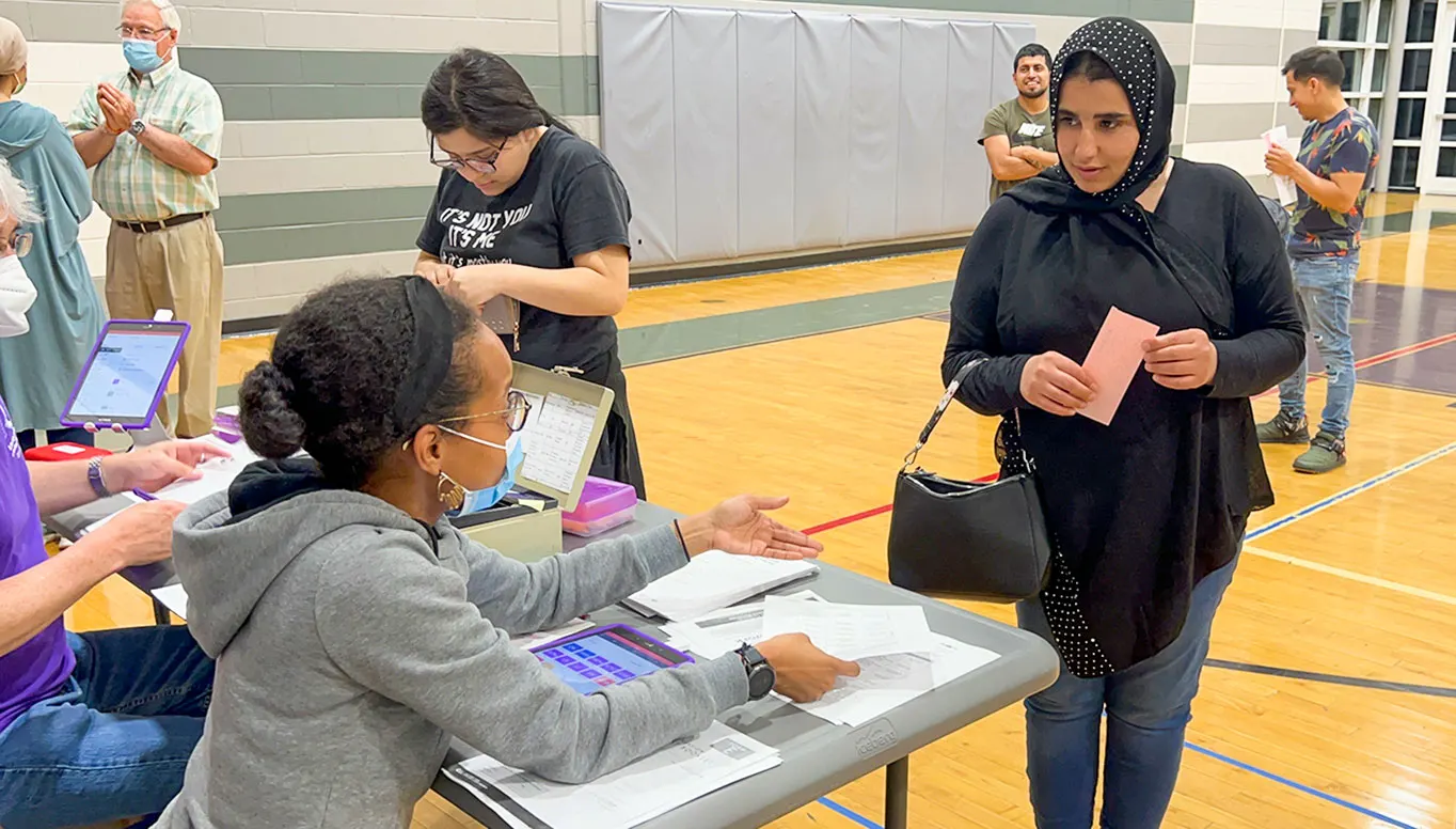 Refugee receive English class timetable