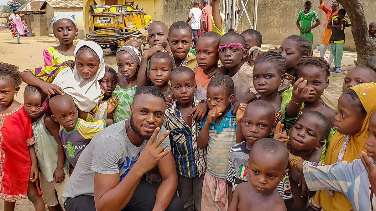 Global Shout team member Tolu Yakubu with children in Nigeria