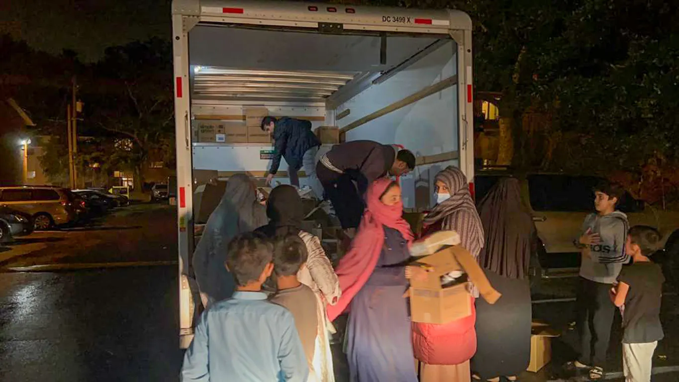 Volunteers distributing food and hygiene packages in Maryland late at night