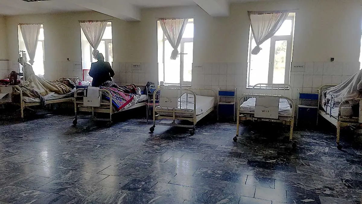 Aliabad hospital ward with 3 patients and caretakers