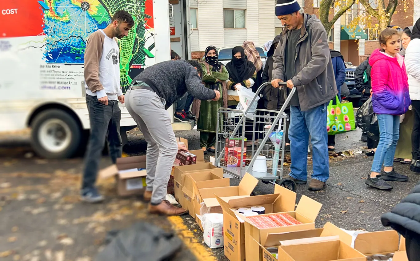 Sorting food and hygiene packages before distributing them to the refugees