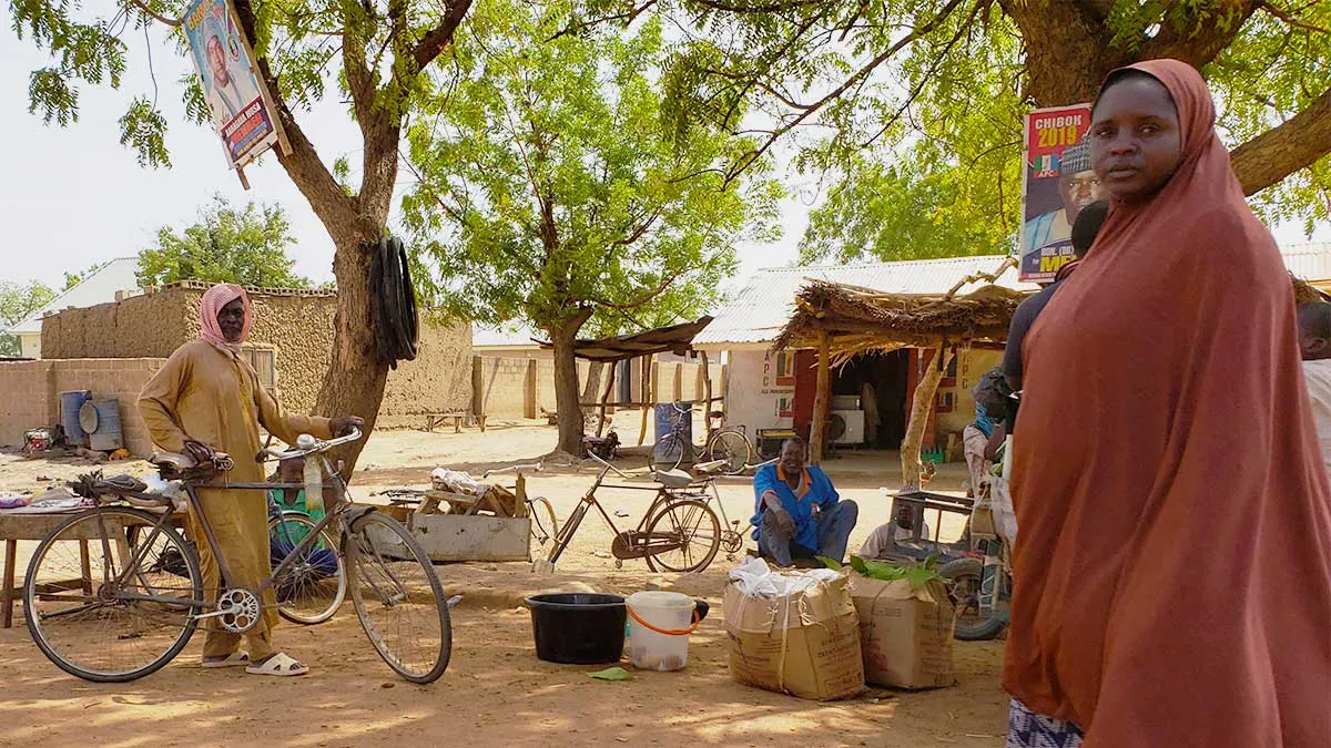 woman walking man about the village